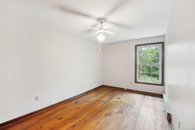 unfurnished room with light hardwood / wood-style floors and ceiling fan