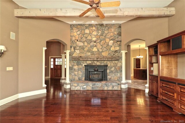 living room with a fireplace, dark wood-type flooring, beamed ceiling, and ceiling fan