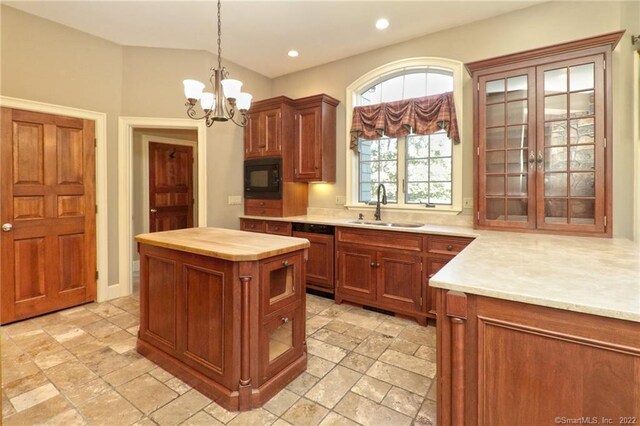 kitchen featuring sink, a chandelier, black microwave, and light tile patterned floors