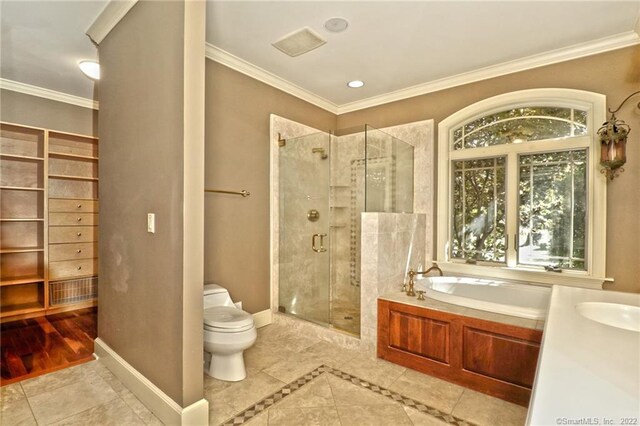 full bathroom featuring crown molding, tile patterned floors, plus walk in shower, and toilet