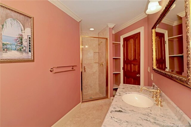 bathroom featuring tile patterned floors, walk in shower, crown molding, built in features, and sink