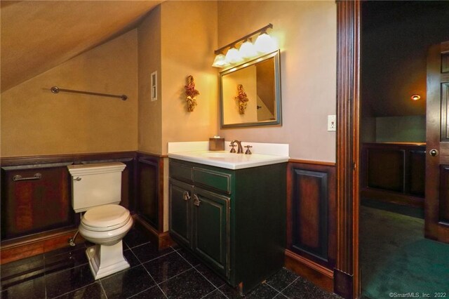 bathroom with tile patterned floors, vanity, and toilet