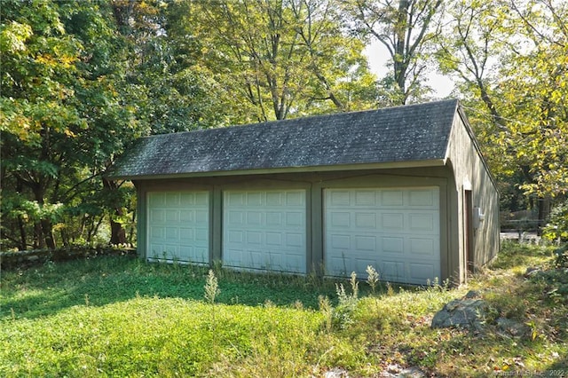 garage with a yard