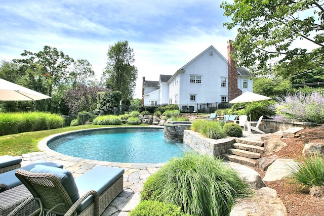 view of pool with fence, a patio area, and a fenced in pool
