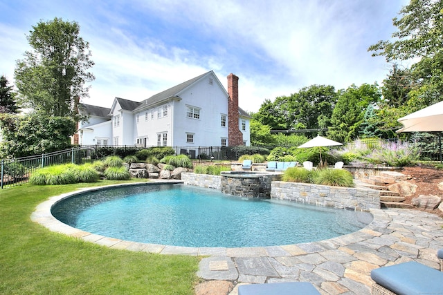 view of swimming pool featuring a fenced backyard, a yard, and a fenced in pool