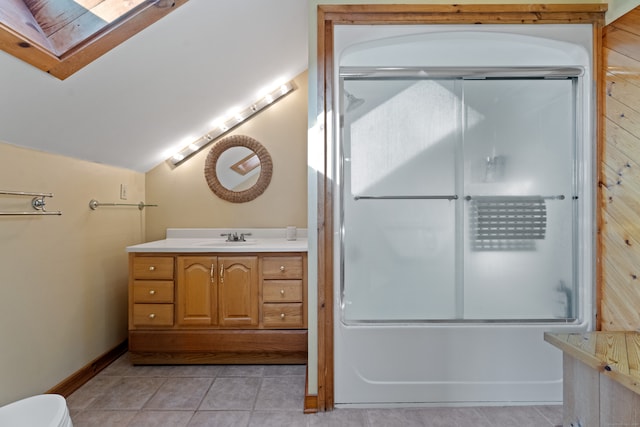 full bathroom featuring shower / bath combination with glass door, vaulted ceiling, toilet, tile floors, and vanity