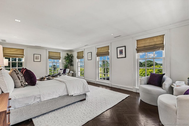 bedroom featuring access to exterior, dark parquet flooring, and crown molding