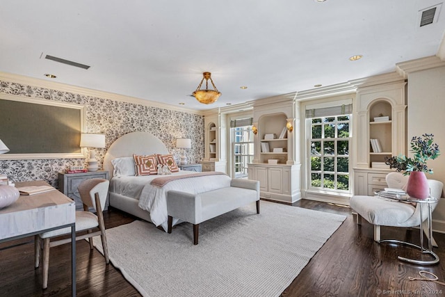 bedroom with crown molding and dark wood-type flooring