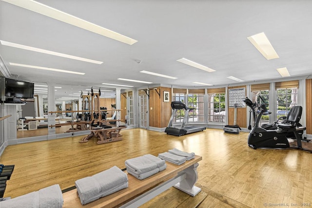 gym with light hardwood / wood-style flooring