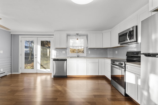 kitchen with white cabinets, sink, appliances with stainless steel finishes, and french doors