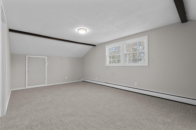 additional living space with lofted ceiling with beams, carpet floors, and a baseboard radiator