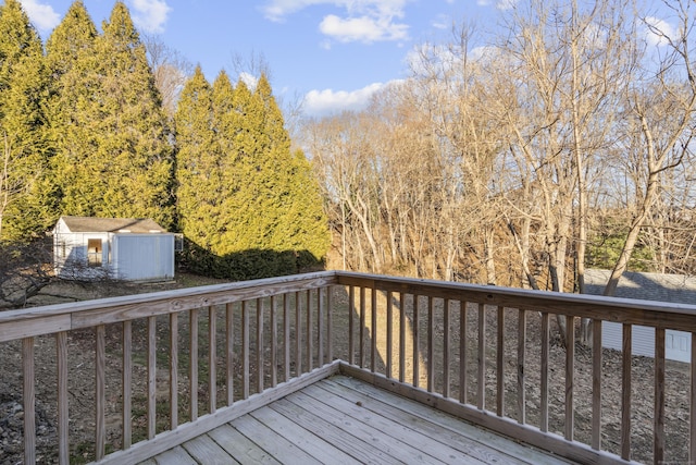 wooden deck featuring a shed