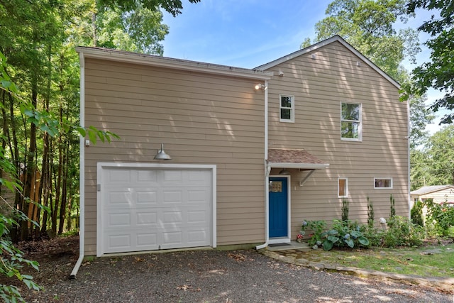 view of front of property with a garage