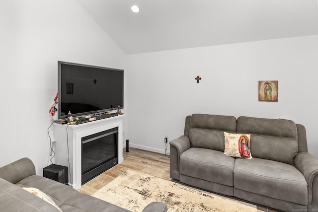 262 Great Plain Rd Unit 13, Danbury, CT 06810 - living room with wood finished floors, vaulted ceiling, a glass covered fireplace, baseboards, and recessed lighting