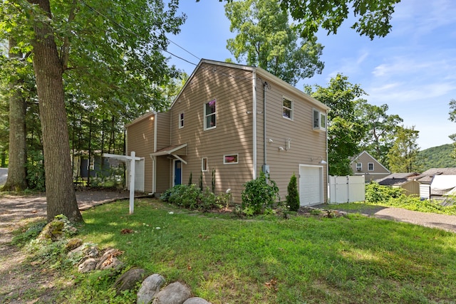 view of home's exterior with a yard