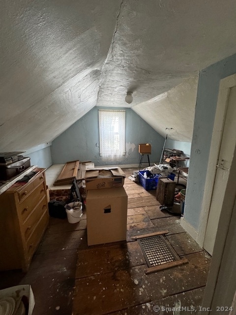 bonus room featuring a textured ceiling and lofted ceiling