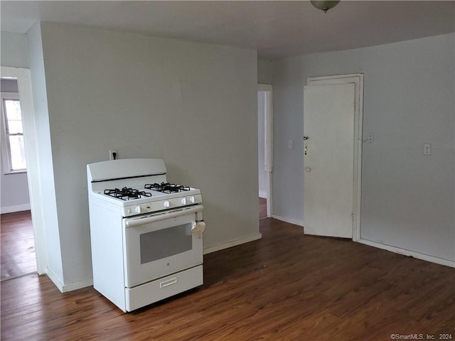 kitchen featuring gas range gas stove and dark hardwood / wood-style flooring