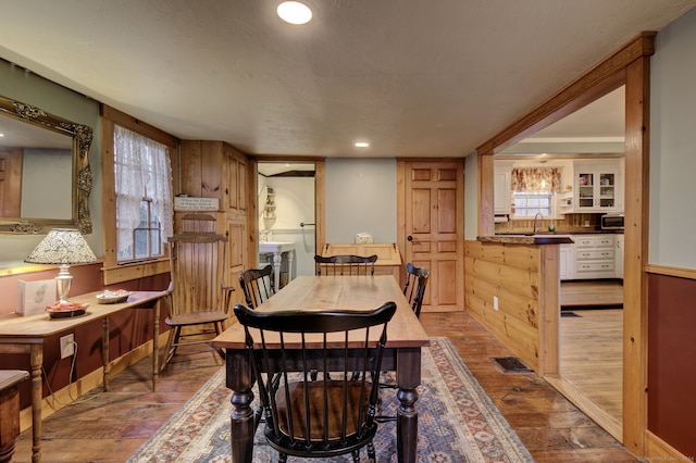 dining room featuring hardwood / wood-style floors and sink