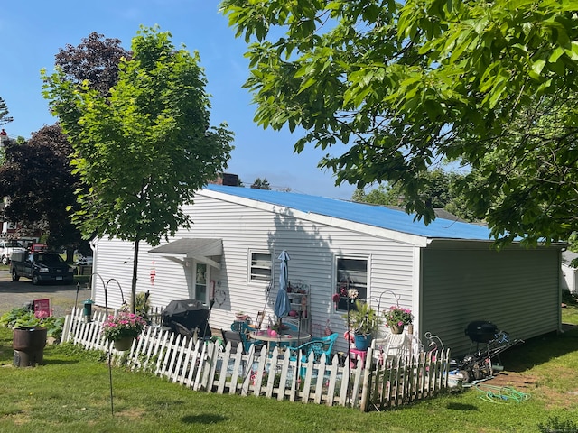 rear view of house with a lawn