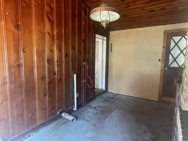 misc room featuring wooden walls and wooden ceiling