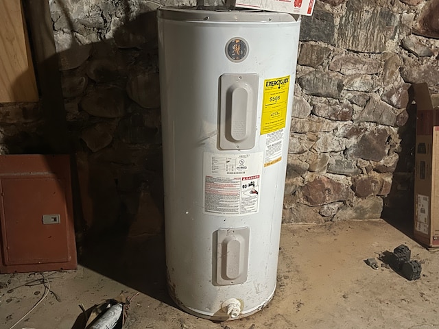 utility room with electric water heater