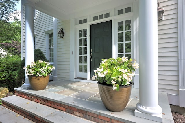 doorway to property featuring a porch