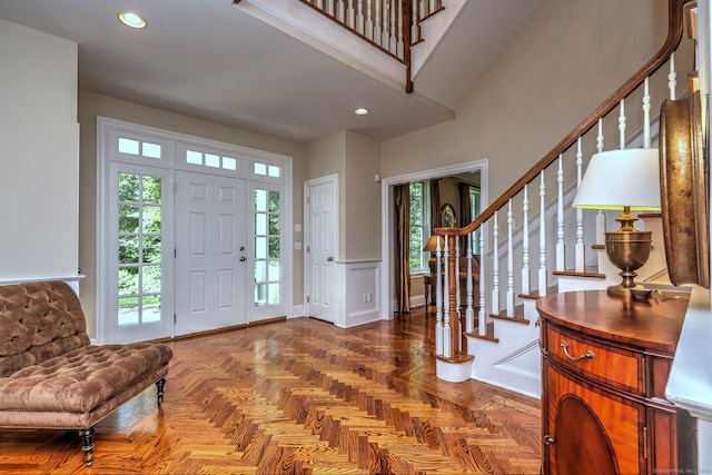 foyer featuring parquet floors