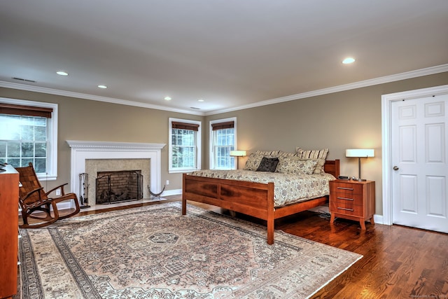 bedroom with ornamental molding and dark wood-type flooring