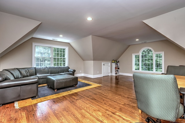 office featuring hardwood / wood-style floors, vaulted ceiling, and a wealth of natural light