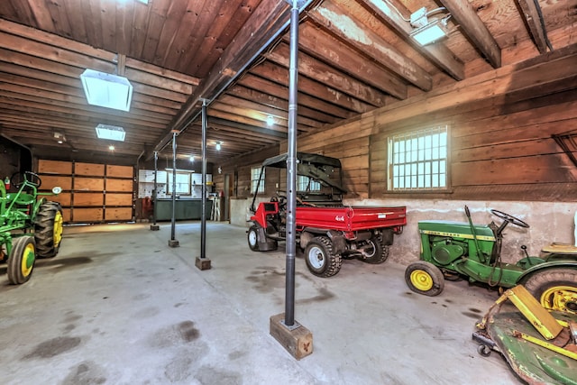 garage featuring wooden walls