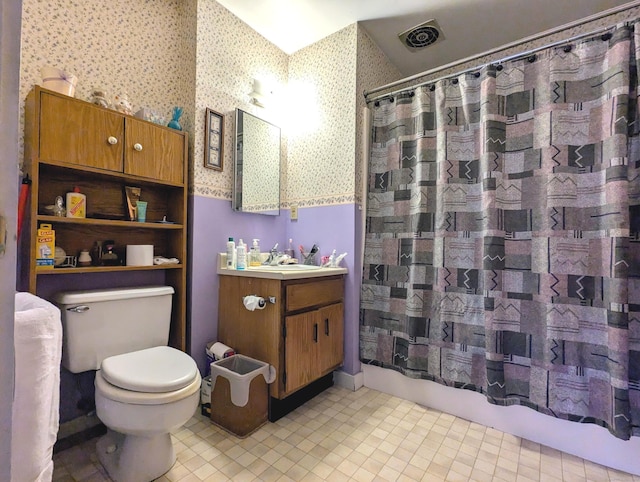 full bathroom featuring vanity, toilet, and shower / bath combo with shower curtain