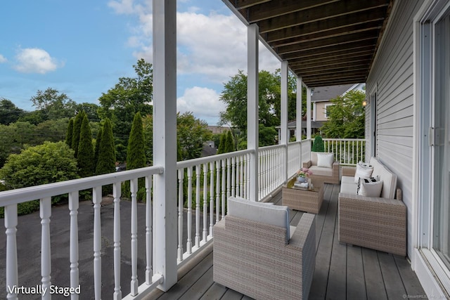 wooden deck with an outdoor hangout area