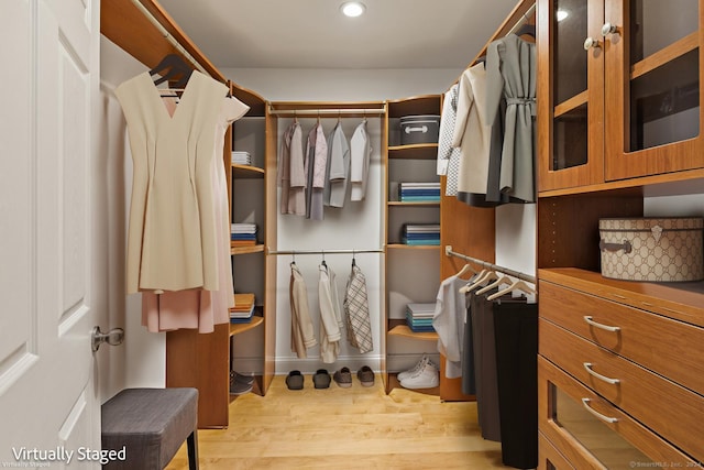 spacious closet featuring light wood-type flooring