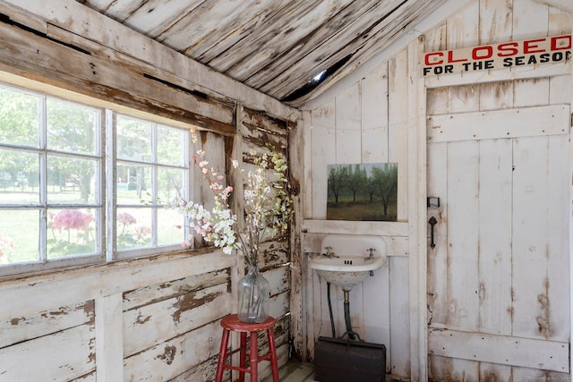 bathroom featuring lofted ceiling