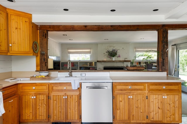 kitchen with dishwasher, kitchen peninsula, tasteful backsplash, and sink