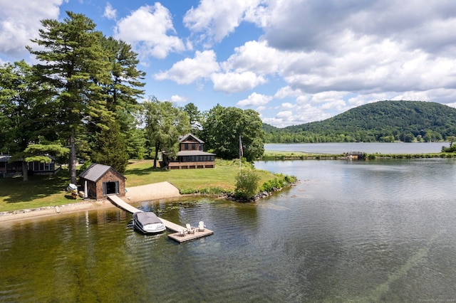 view of water feature with a mountain view and a dock