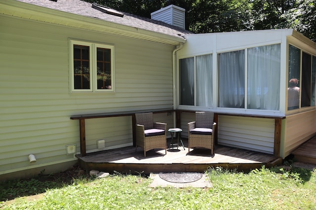 wooden terrace featuring a sunroom