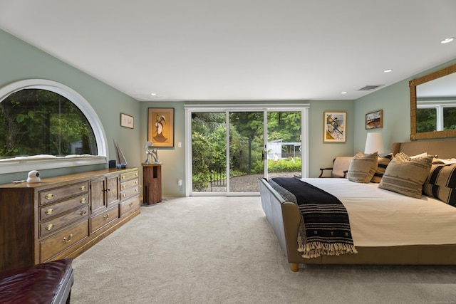 carpeted bedroom featuring access to exterior