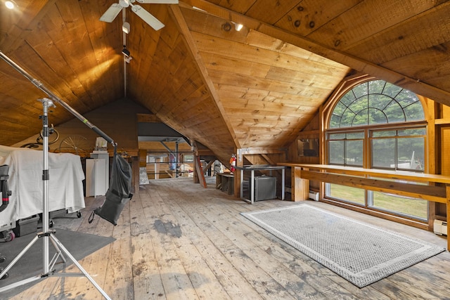 interior space with a wealth of natural light, wooden ceiling, and vaulted ceiling