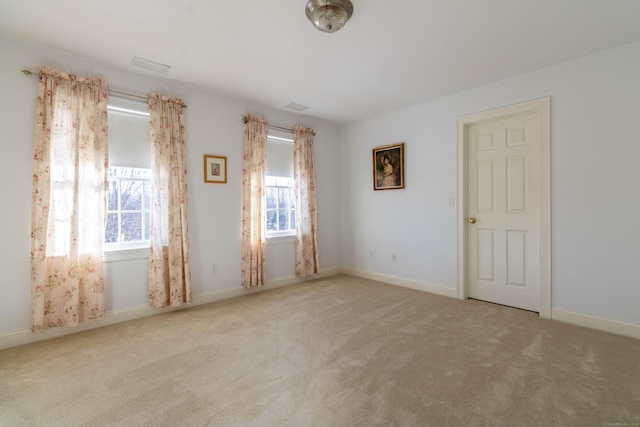 empty room featuring light carpet