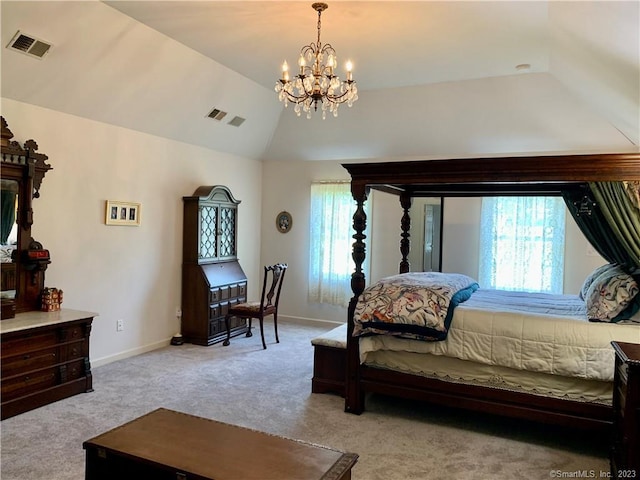 carpeted bedroom with a chandelier and lofted ceiling