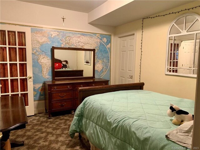 bedroom featuring dark colored carpet