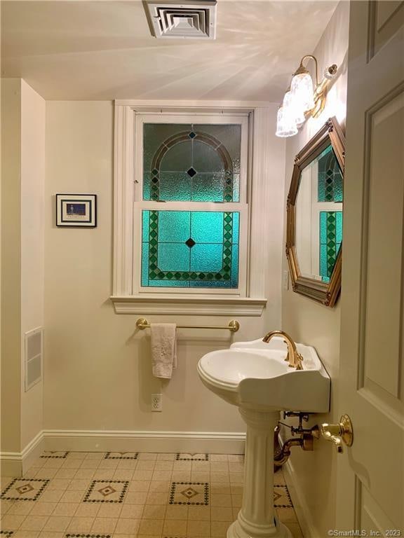 bathroom featuring tile floors