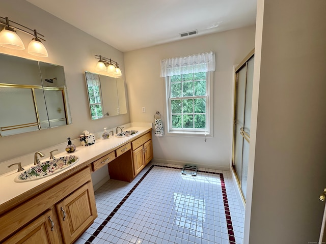 bathroom with dual sinks, tile floors, and large vanity