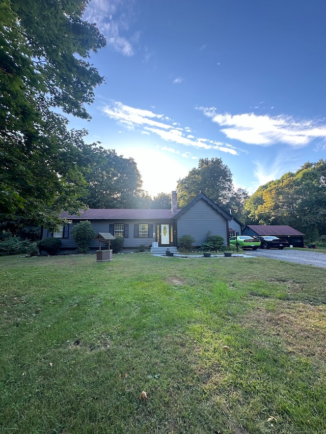 ranch-style home with a front lawn