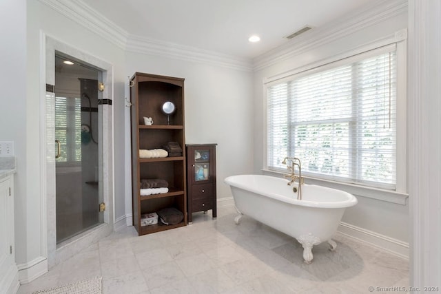 bathroom featuring crown molding and separate shower and tub