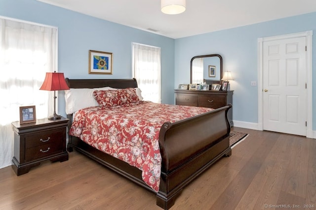 bedroom with hardwood / wood-style flooring