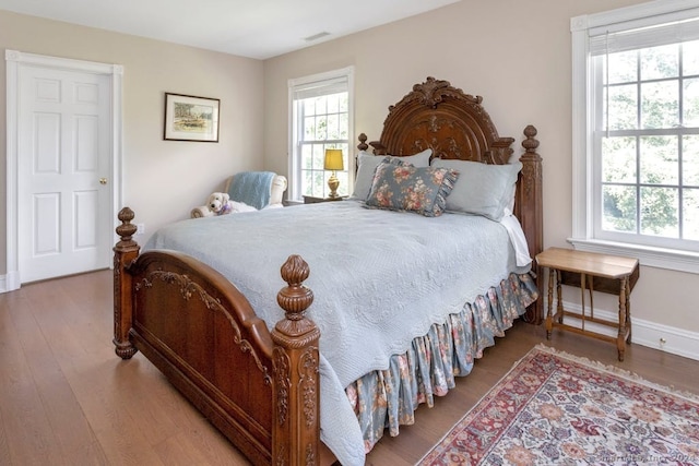 bedroom with wood-type flooring