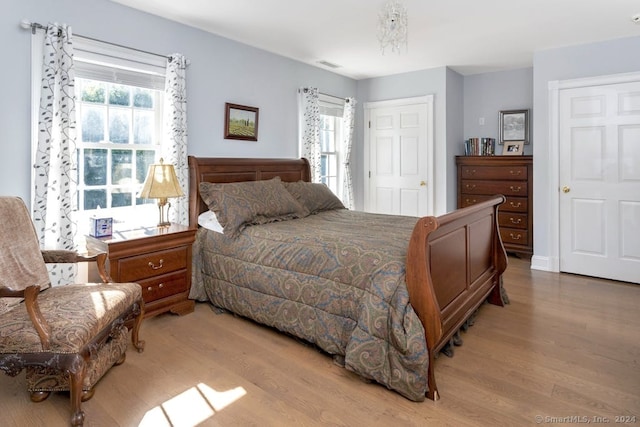 bedroom with a closet and light wood-type flooring