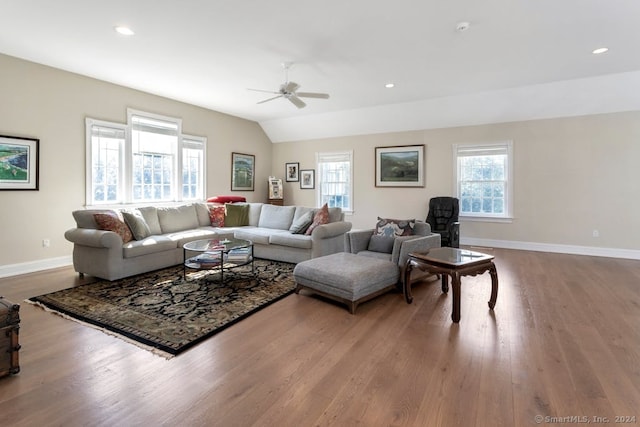 living room featuring ceiling fan, vaulted ceiling, and hardwood / wood-style floors